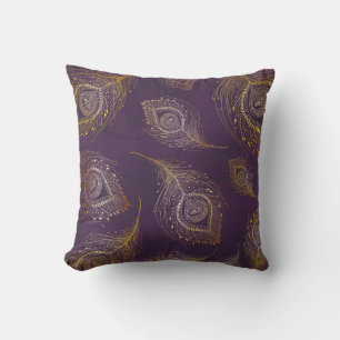 Gold peacock feather, violet background. cushion