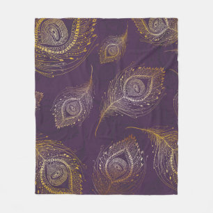 Gold peacock feather, violet background. fleece blanket