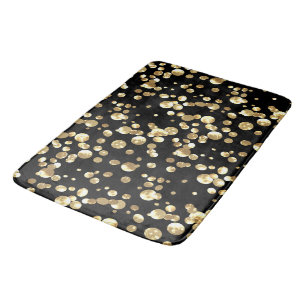 Gold polka dots on a black background . bath mat
