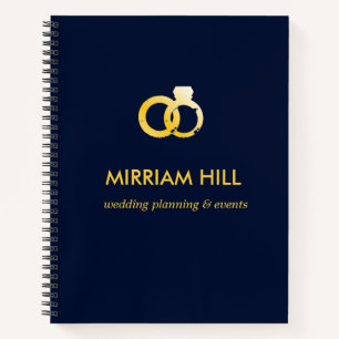 Gold rings dark blue wedding planner notebook