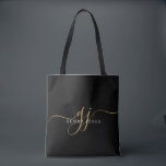 Gold Script Monogram Black Tote Bag<br><div class="desc">A chic modern stylish gold white monogram on black tote bag,  with a dramatic script initial with swashes and your full name in a modern serif type, </div>