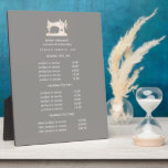 Gold Sewing Machine Seamstress Grey pricing   Plaque<br><div class="desc">Understated design displays your services, price list or business information beneath an illustration of a vintage sewing machin in faux gold over a Grey taupe background and your name or business name. Includes three customisable headings and body text fields. To adjust layout, enter your text and then use the Customise...</div>