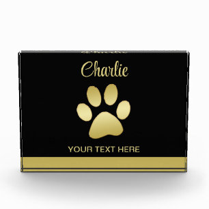Gold Shiny Dog Paw on black background Photo Block