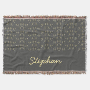 Gold snowflakes on grey throw blanket