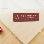 Gold Sparkles & Family Name Red Christmas Return Address Label<br><div class="desc">A fun Christmas design for all your holiday mail. This return address label features faux gold hand-drawn sparkles on the left-hand side, with your family name and address details on the right. The background is a warm red colour - perfect for the holiday season! These labels are perfect for enhancing...</div>