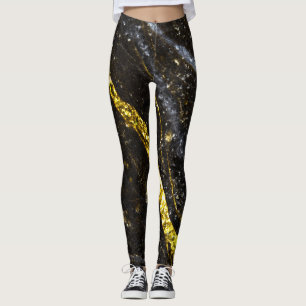 Gold sparkly line on black rock leggings