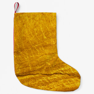 Gold stone texture background. abstract, antique, small christmas stocking