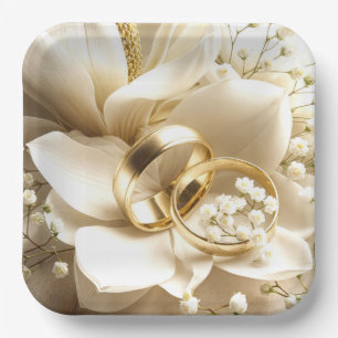 Gold Wedding Bands On a Magnolia Flower Paper Plate