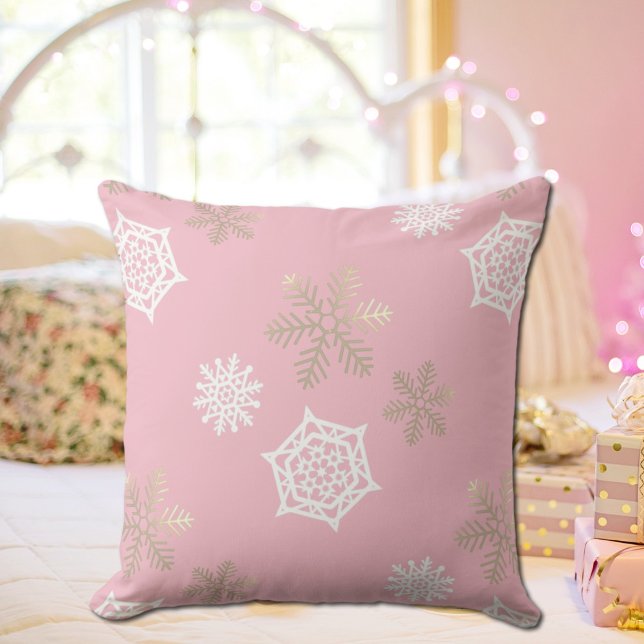 golden and white snowflakes against pale pink cushion (Creator Uploaded)