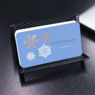 golden and white snowflakes in light blue business card