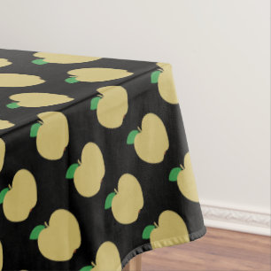 Golden Apple on Black Tablecloth