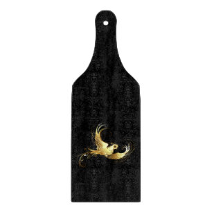 Golden Bird on Black Background Cutting Board