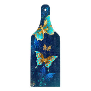 Golden Butterflies on a Blue Background Cutting Board