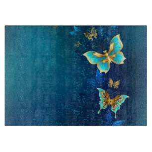 Golden Butterflies on a Blue Background Cutting Board
