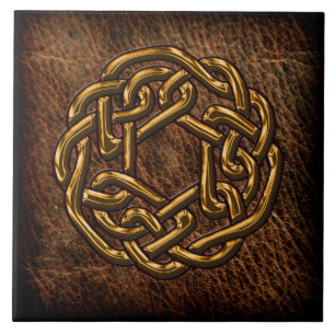 Golden celtic knot on leather ceramic tile