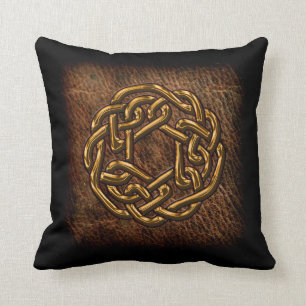 Golden celtic knot on leather cushion