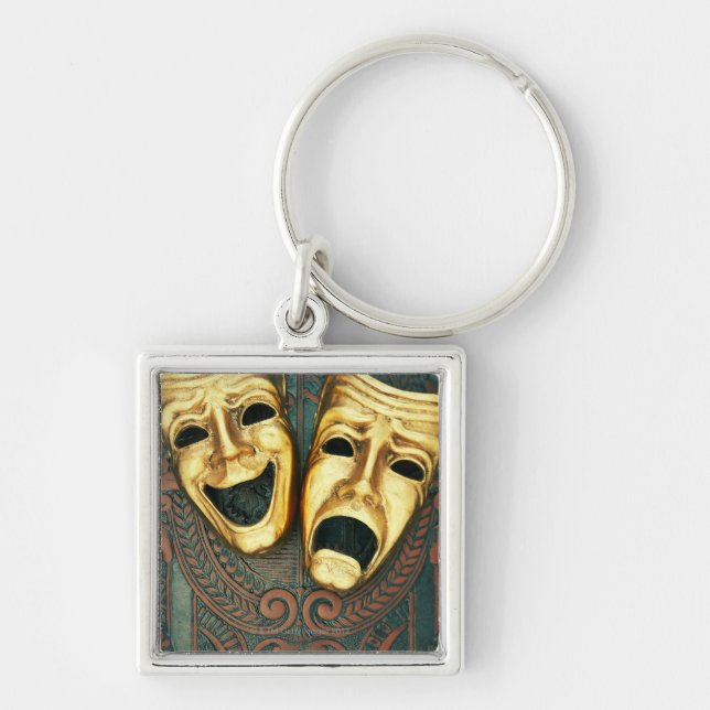 Golden comedy and tragedy masks on patterned key ring (Front)