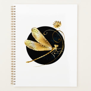 Golden dragonfly in black circle planner