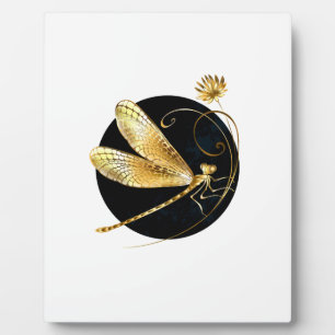 Golden dragonfly in black circle plaque