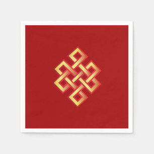 Golden endless knot on burgundy red napkin