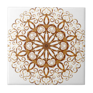 Golden filigree flake on white ceramic tile