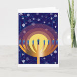 Golden Glowing Hanukkah Menorah Greeting Card<br><div class="desc">Bring the beautiful lights of Hanukkah into the winter season with this original design greeting card. It pictures the candles gleaming atop a golden menorah, with snow lightly falling in the background. Send greeting cards that your friends and loved ones will remember for their beautiful, unique artistry. Whether you call...</div>