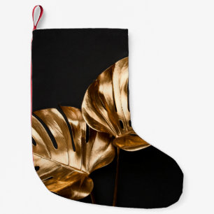 Golden painted date palm leaf closeup on abstract  small christmas stocking