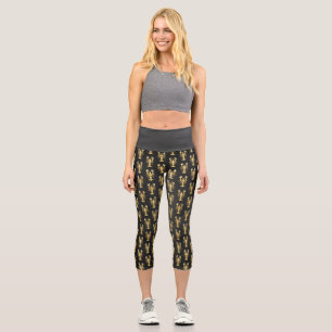 Golden polygonal lobster crawfish on black capri leggings