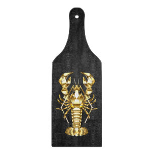 Golden polygonal lobster crawfish on black cutting board