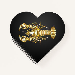 Golden polygonal lobster crawfish on black notebook