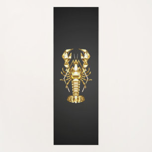 Golden polygonal lobster crawfish on black yoga mat