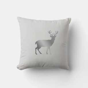 Golden reindeer silhouette on silver grey cushion