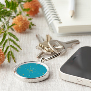 Golden snowflake keychain. key ring
