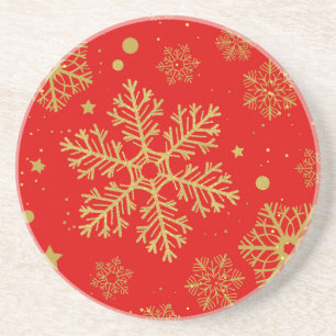 Golden snowflakes on red coaster