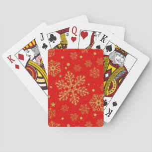 Golden snowflakes on red playing cards