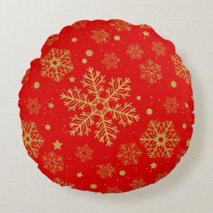 Golden snowflakes on red round cushion