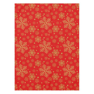 Golden snowflakes on red tablecloth