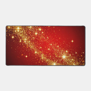 Golden Sparkling Trail on Vibrant Red Background Desk Mat