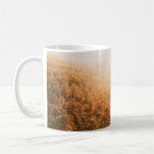 GOLDEN SUN OVER A FOREST COFFEE MUG