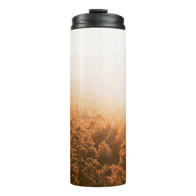 GOLDEN SUN OVER A FOREST THERMAL TUMBLER (Front)