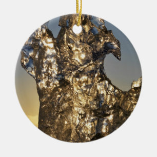Golden sunrise seen through iceberg formation ceramic tree decoration
