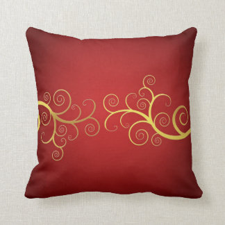 Golden swirls on red elegant pillow