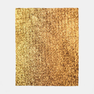 Golden textile: glamourous macro background. fleece blanket