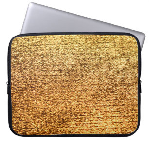 Golden textile: glamourous macro background. laptop sleeve