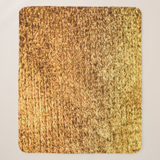 Golden textile: glamourous macro background. sherpa blanket