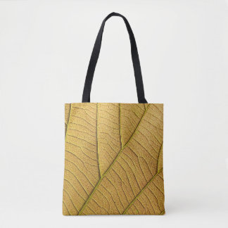 Golden yellow leaf pattern in the morning.  tote bag