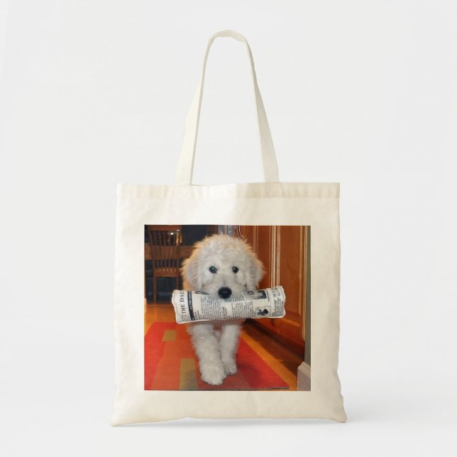 Goldendoodle carrying newspaper toy tote (Front)