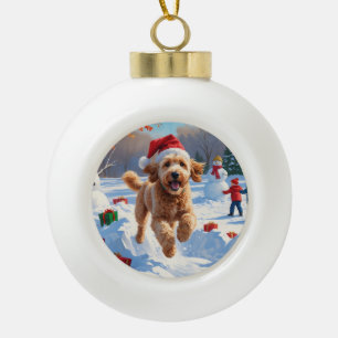 Goldendoodle Running in Snow with Christmas Hat Ceramic Ball Christmas Ornament