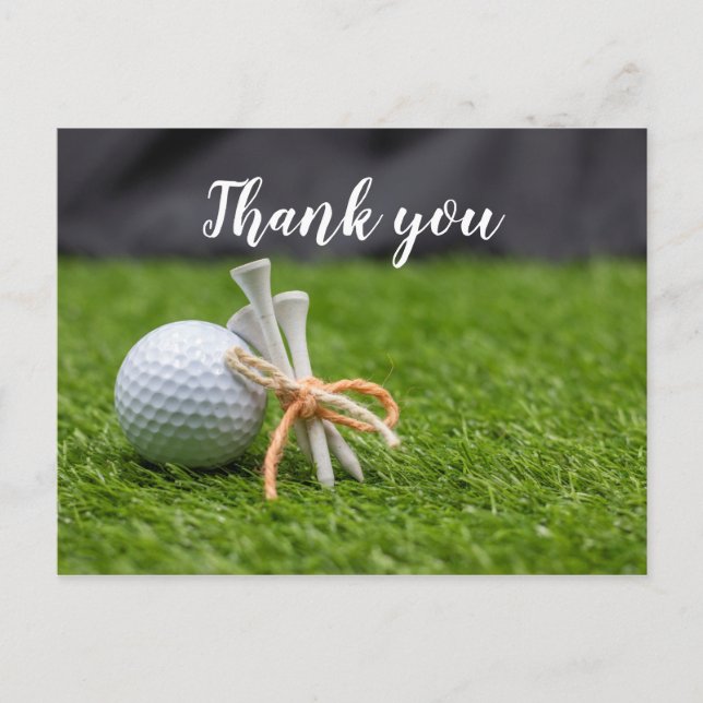 Golf ball and tee are on green grass thank you postcard (Front)