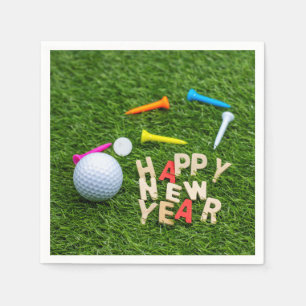 Golf ball and tee with Happy New Year on green Napkin